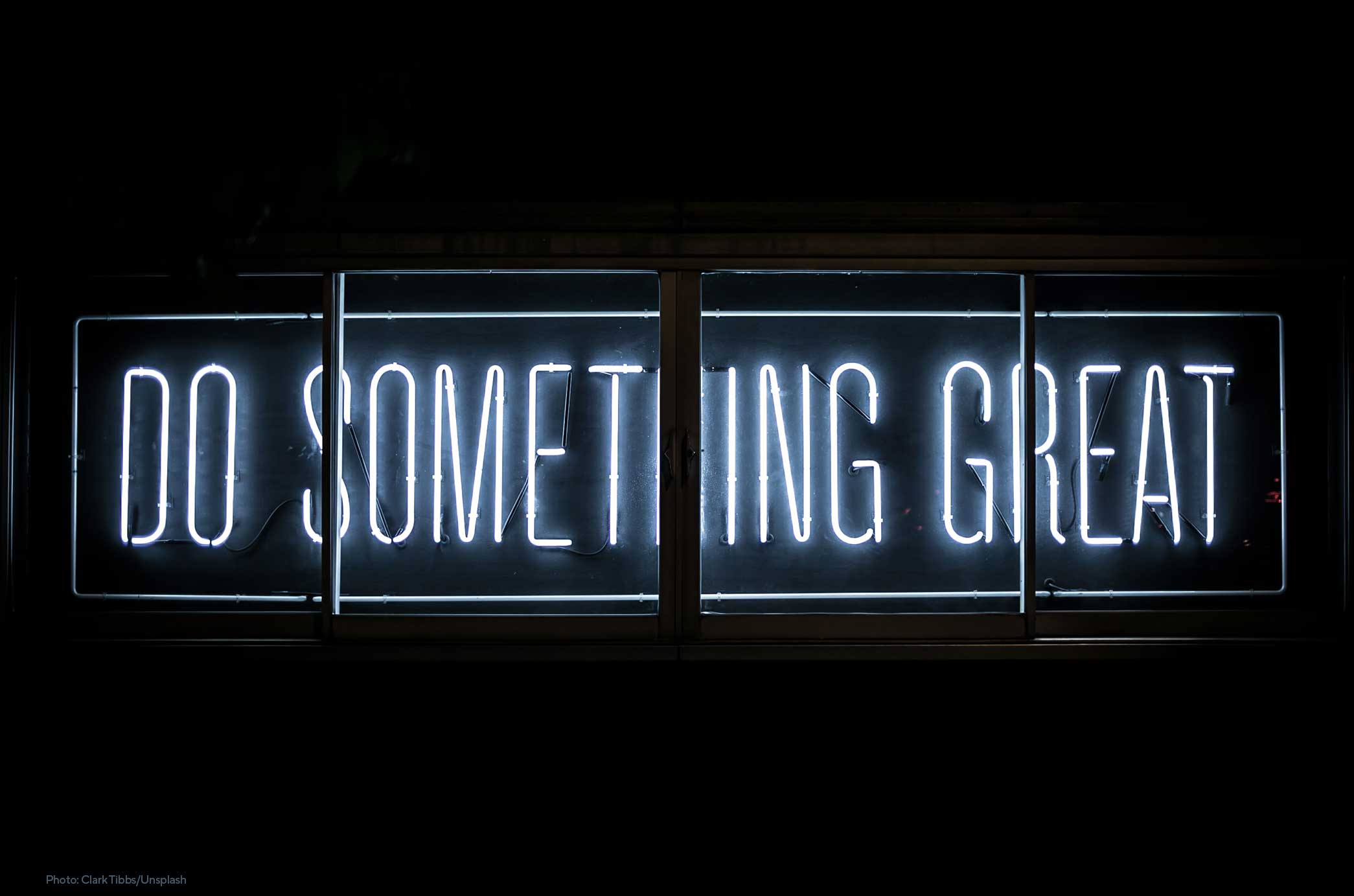 Neon lights spelling “Do Something Great”