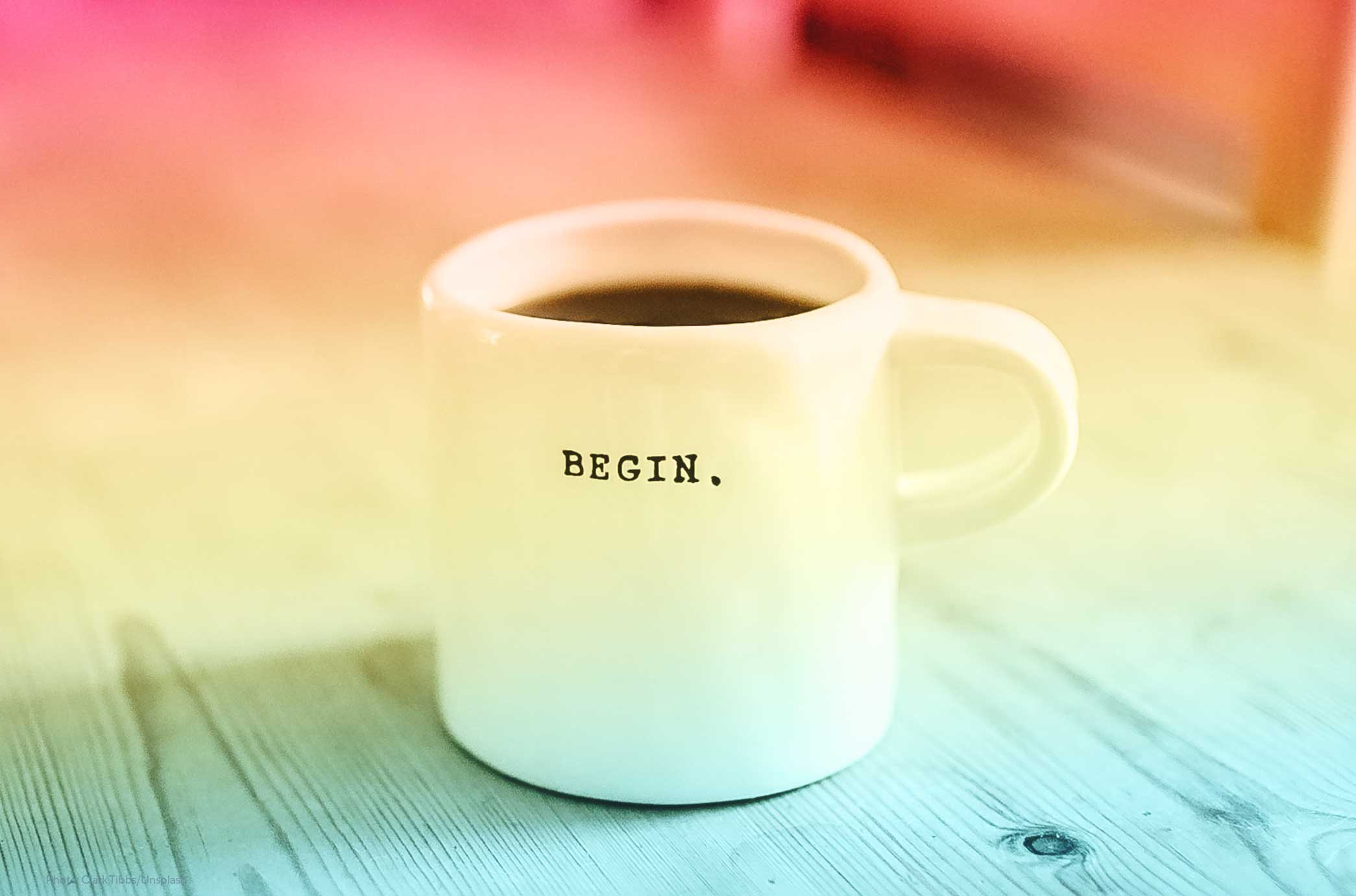Coffee cup with the word “Begin” on it